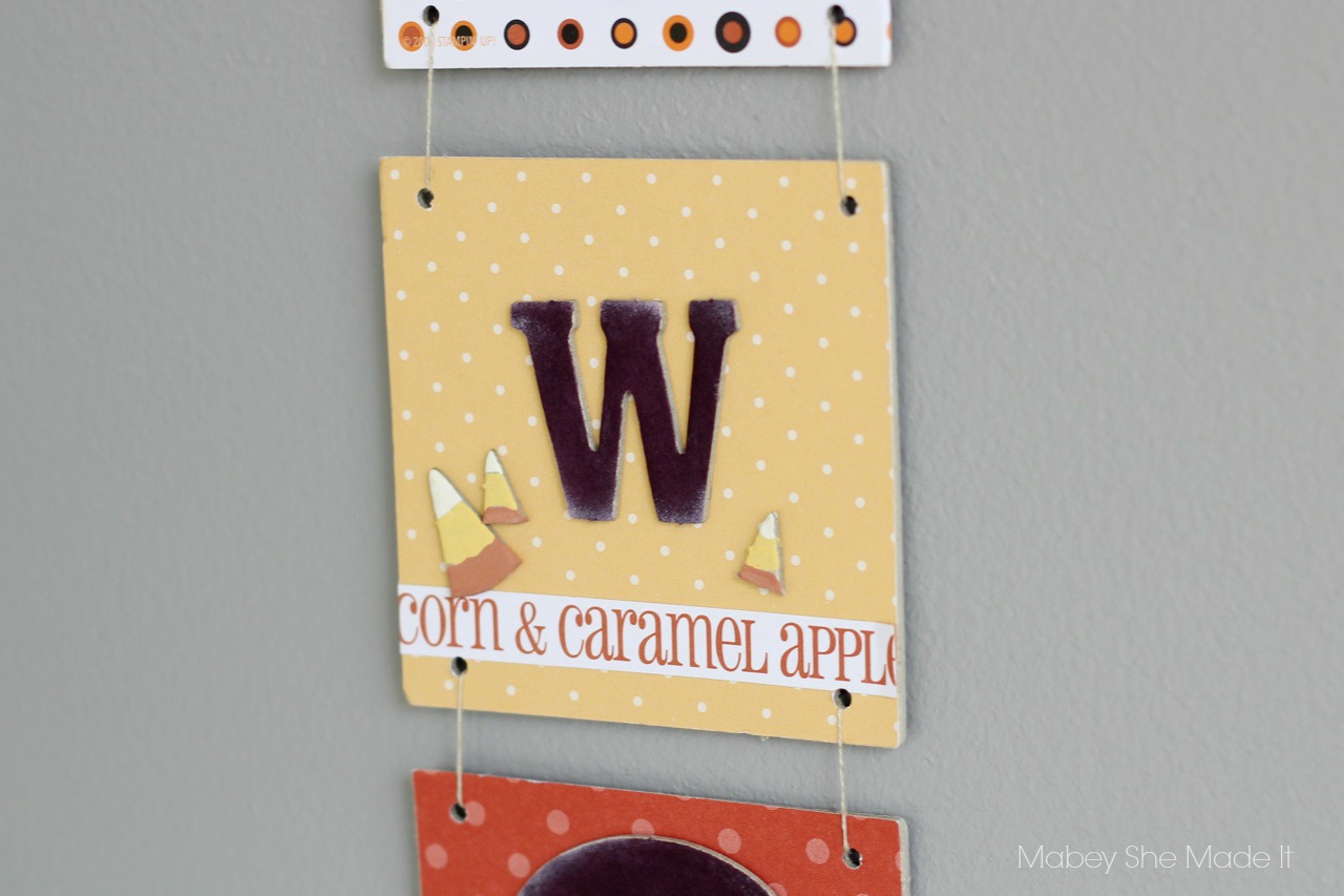 Halloween Door Hanging | Mabey She Made It | #halloween #halloweendecor #candycorn #papercrafts @mabeyshemadeit